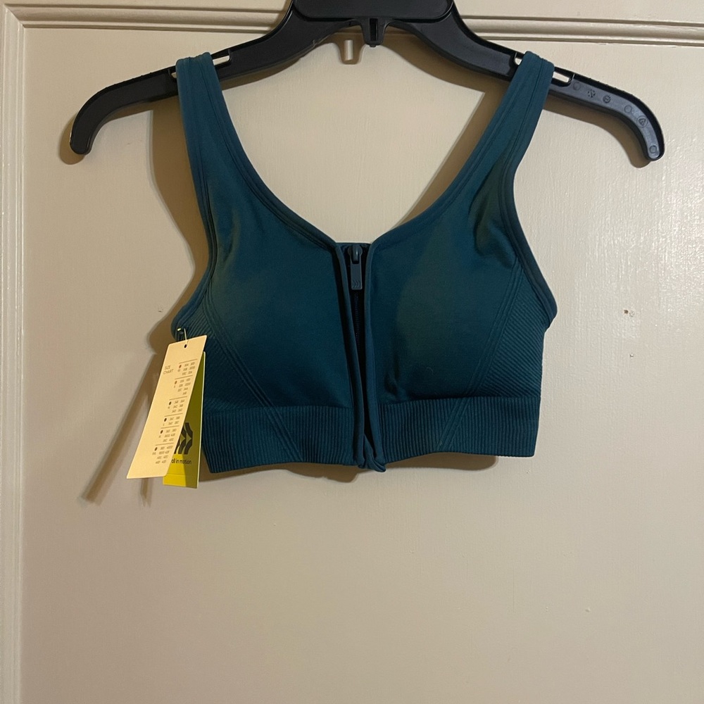 NWT all in motion teal sports bra
